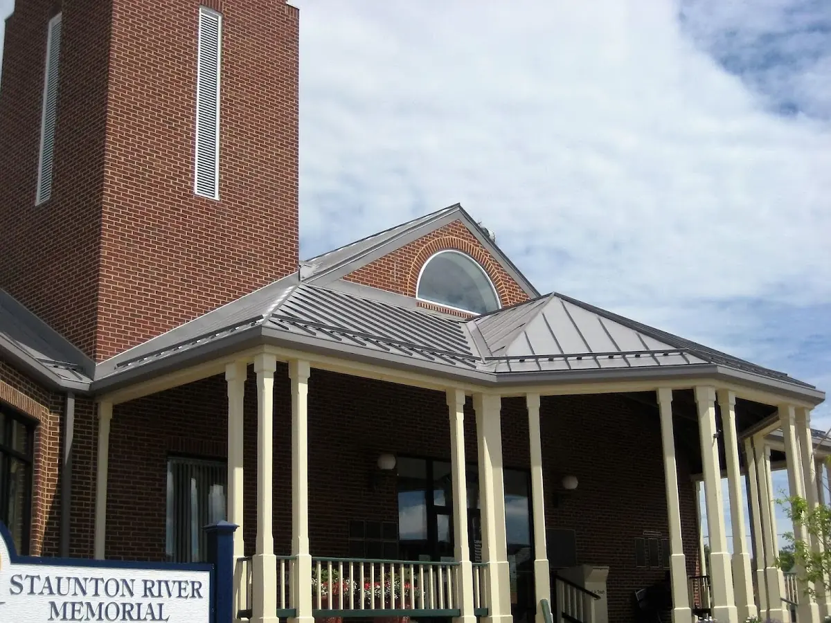 Skilled roofing craftsmen working on a residential roof in Huskum Corner Cross Roads